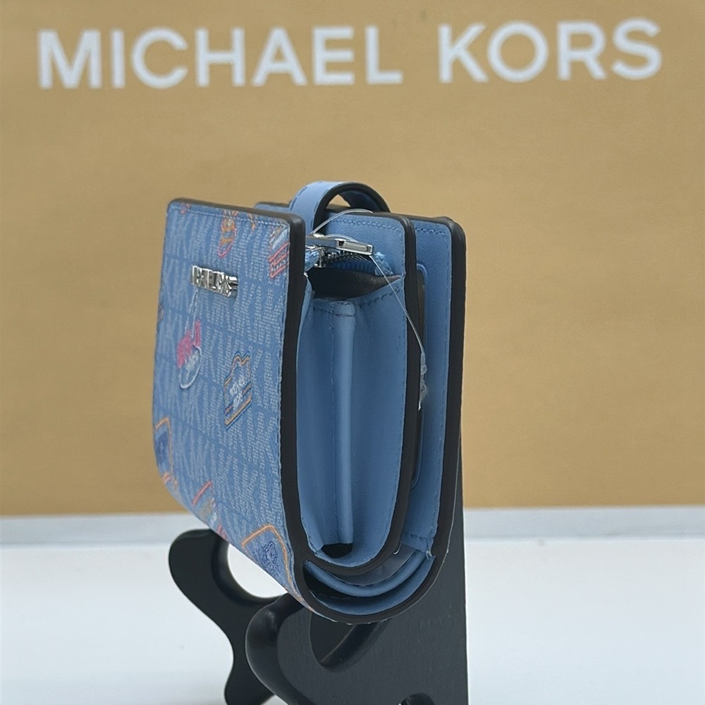 Michael Kors Jet Set Travel Medium Printed Signature Logo Bi-Fold Wallet
LT SKY - Picture 13 of 16